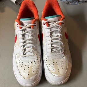Nike Dunk Low Retro SE White and Red Sneakers with Orange Accents